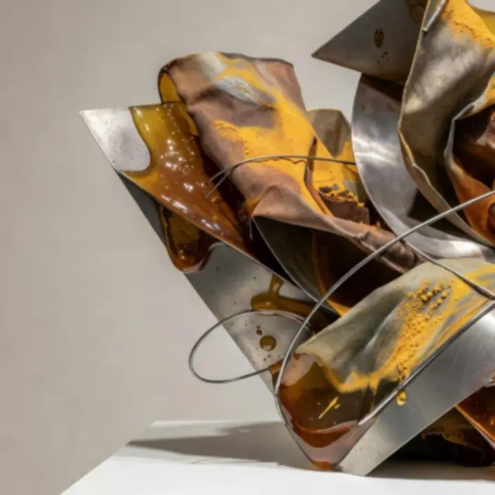 Detail of a mixed-media sculptural installation with layered textures and light.