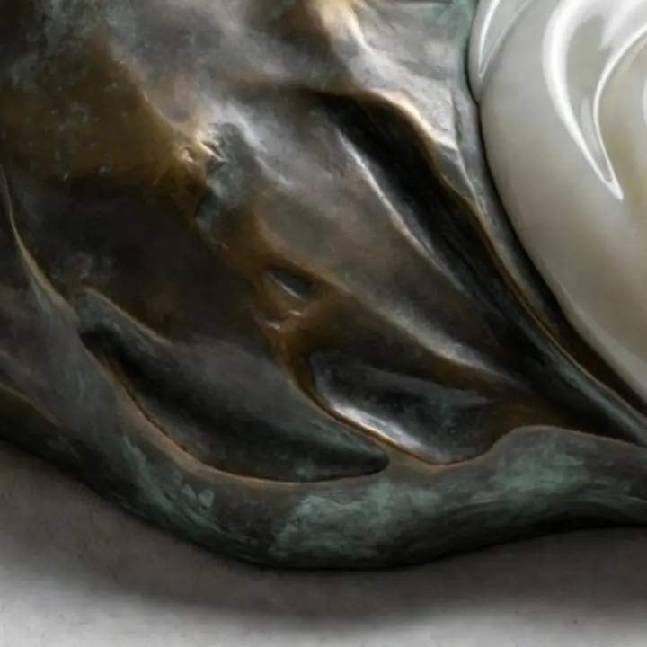 Close-up of layered sculptural texture showing warm, textural finishes.